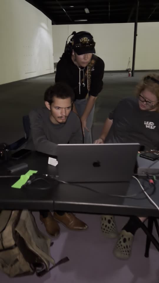 The crew at the laptop between setups