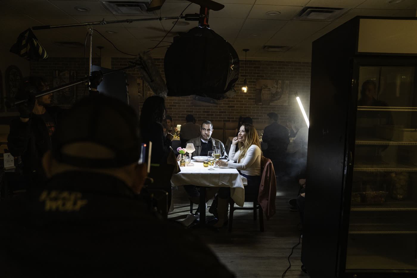 Monitor view of a candlelit dinner scene on Fair Trade