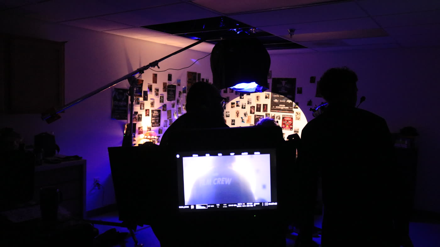 Video village monitor on a warehouse music video set