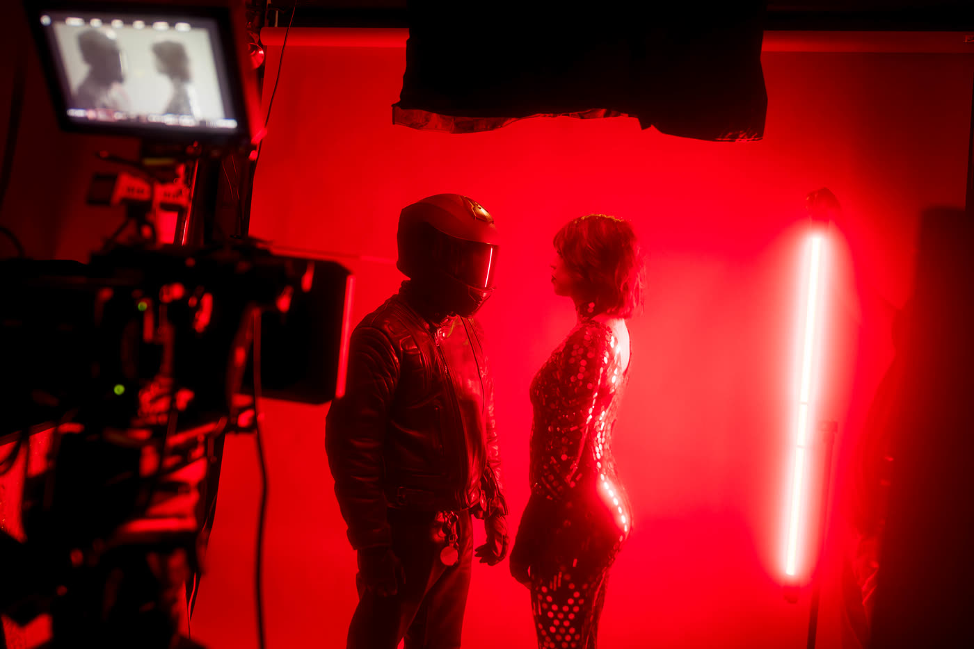 Cinema camera and red practical lights on the Venom set
