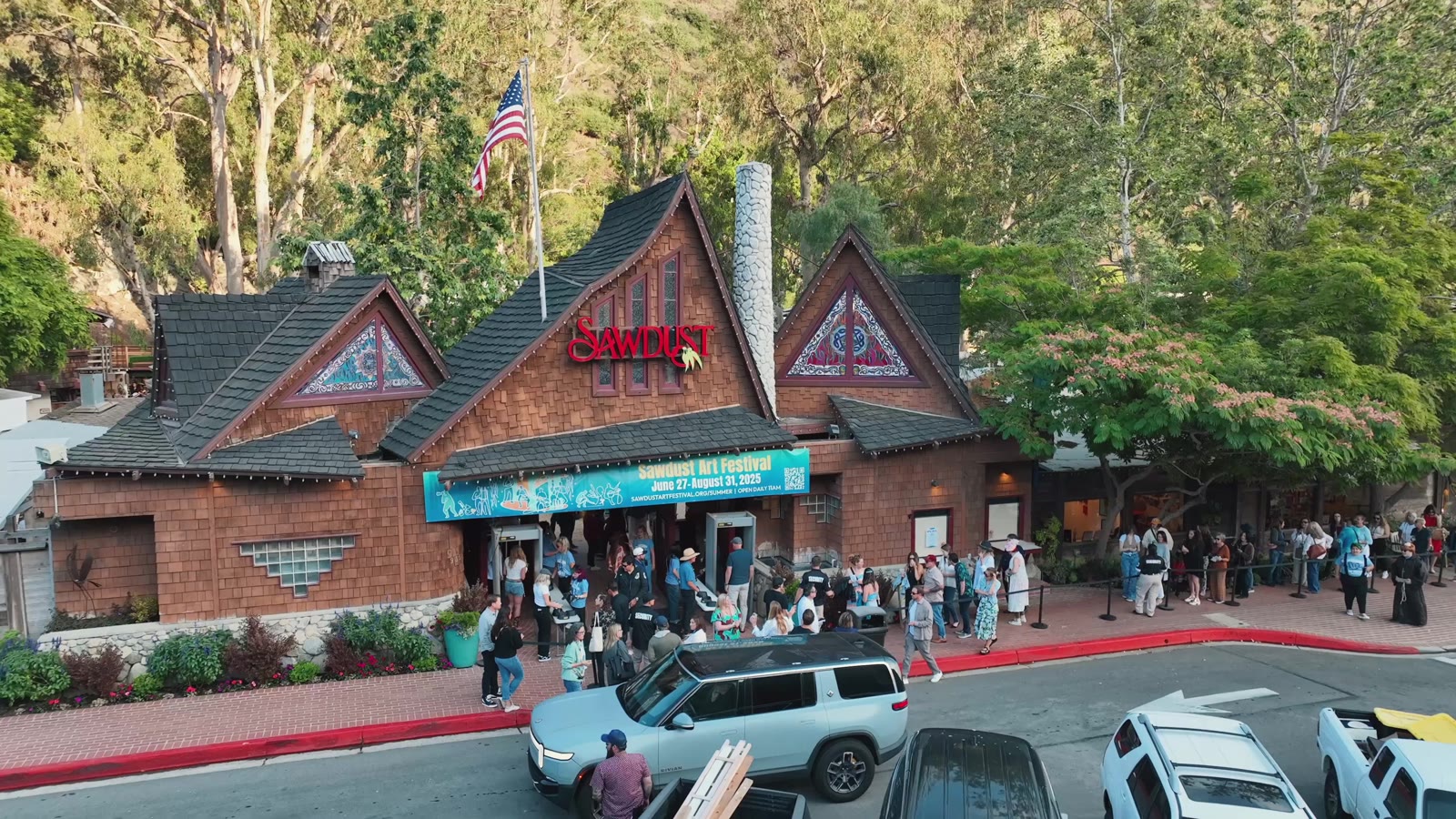 The Sawdust Art Festival entrance in Laguna Beach, with festival-goers lined up outside