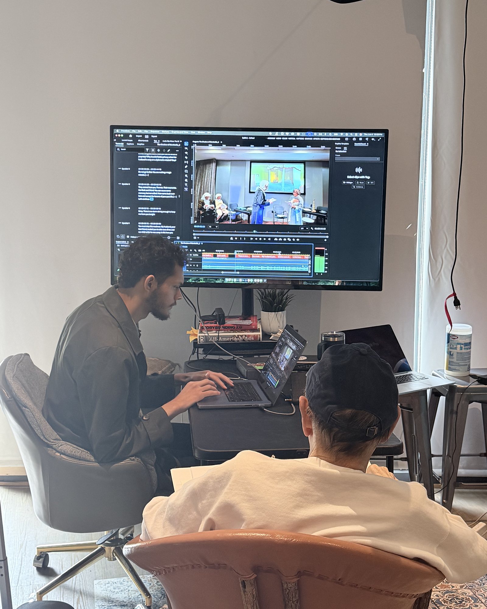 Michael Soares at the edit desk in the Lead Wolf studio, reviewing a cut with a client